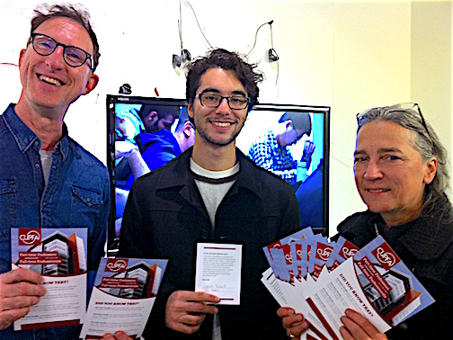 Gabriel Bushell (centre), student in Film Studies, shows his signed card of support for Part-time faculty to have the right to undertake and be paid for administrative and supervisory work, in addition to their teaching duties. Part-time professors Philip Szporer and Mary Ellen Davis stand alongside him at the launch of CUPFA's campaign during Campus Equity Week on October 27th, 2016.
